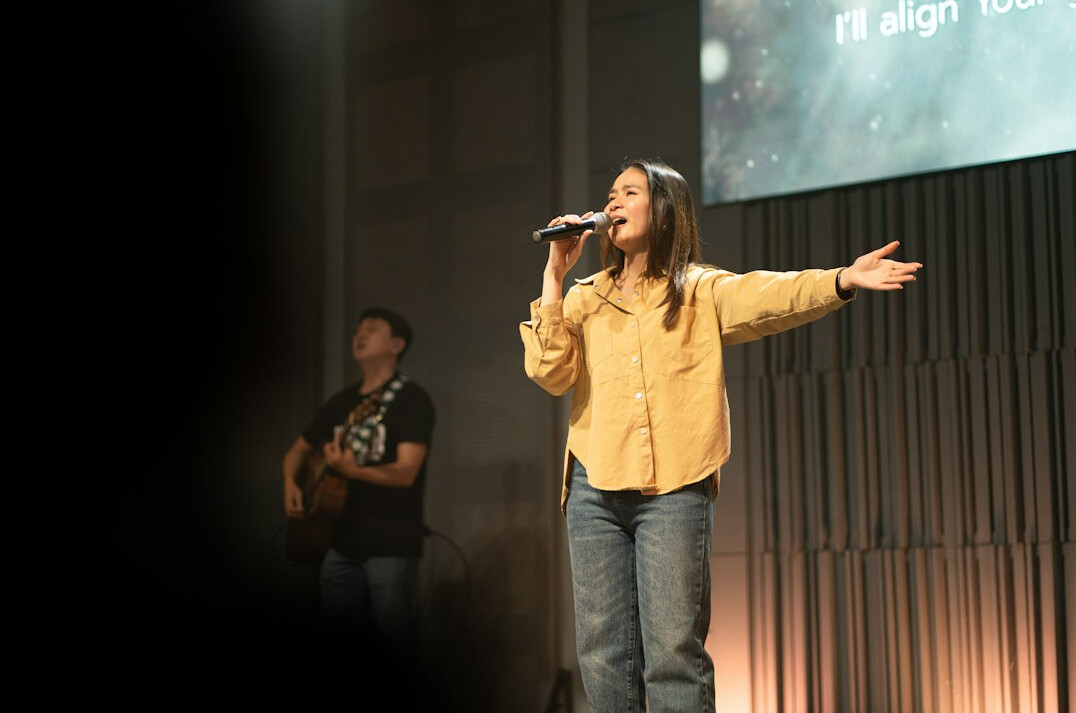 person giving speech on stage